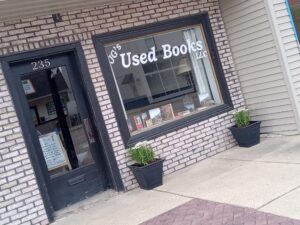 Quaint brick used bookstore exterior with window display