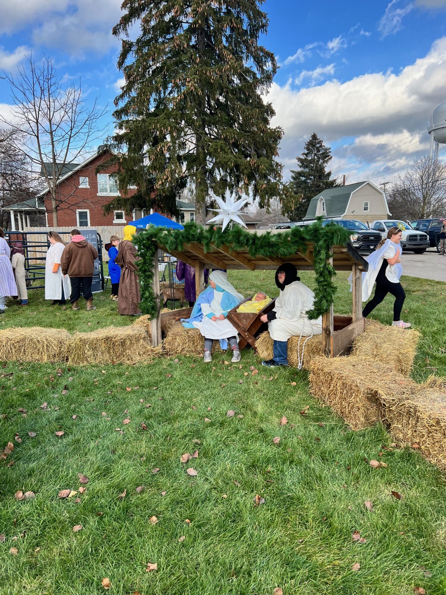 Outdoor nativity scene with children in costumes